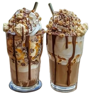 Two chocolate milkshakes topped with whipped cream, nuts, and chocolate drizzle.