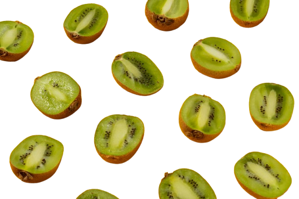 Scattered sliced kiwi halves on a white background.